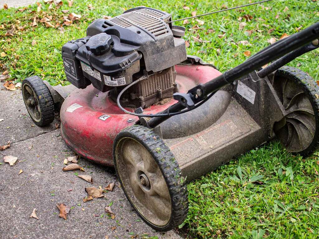 Mower with two wheels on the concrete