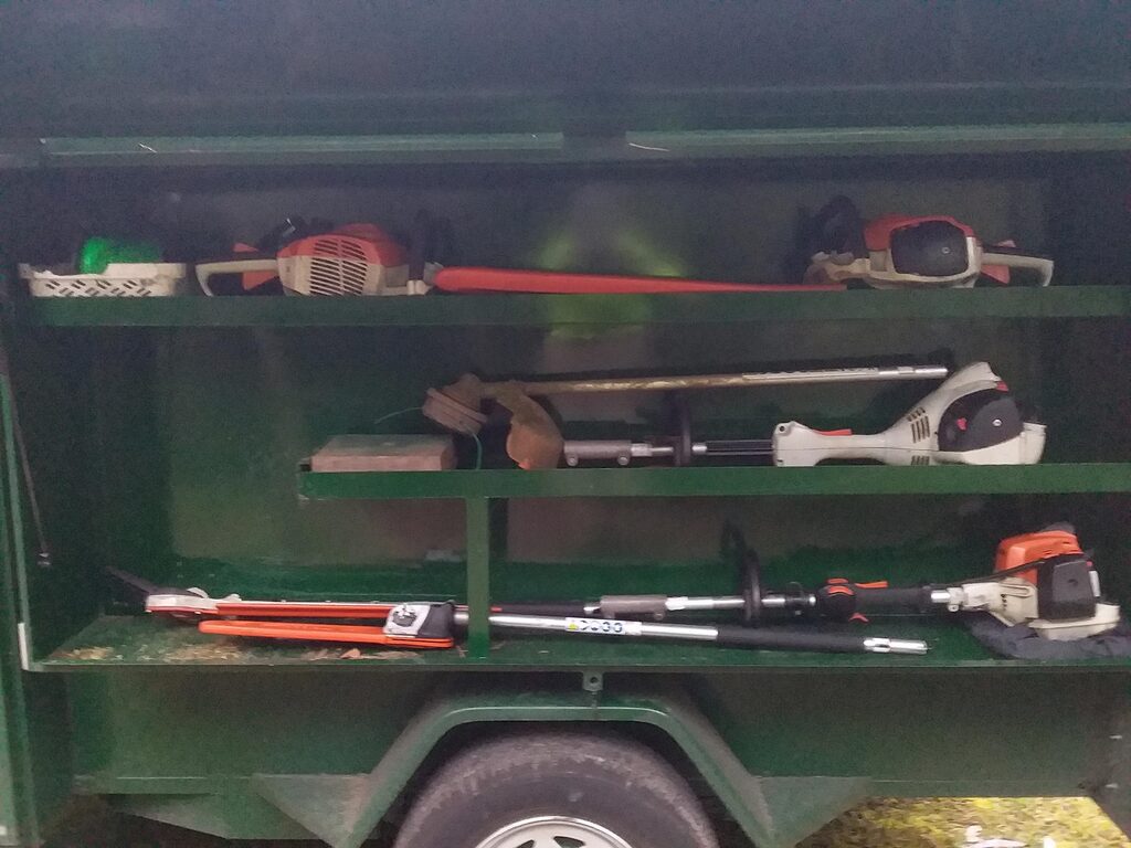 Petrol gardening tools in the trailer