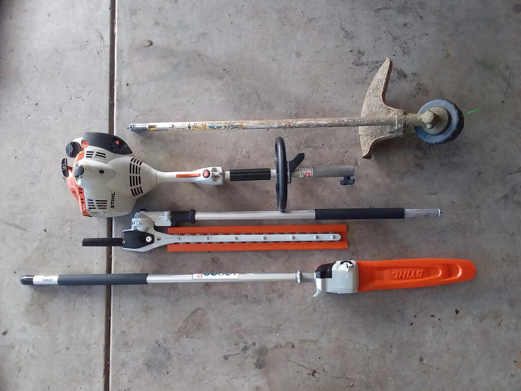 Stihl Kombi combination kit with brushcutter, pole hedger and chainsaw attachments with engine.
