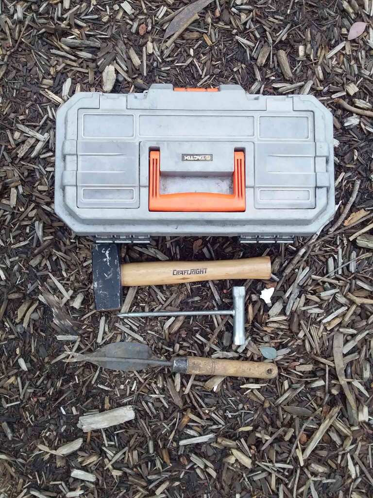 Gardener's toolbox with mallet, scrench, and hand weeding tool 